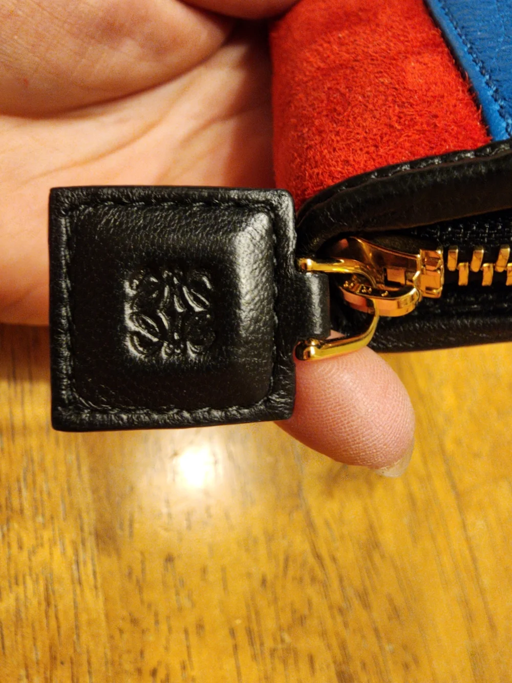 Loewe wallet features  vibrant red suede body & black crocodile Embossed Leather